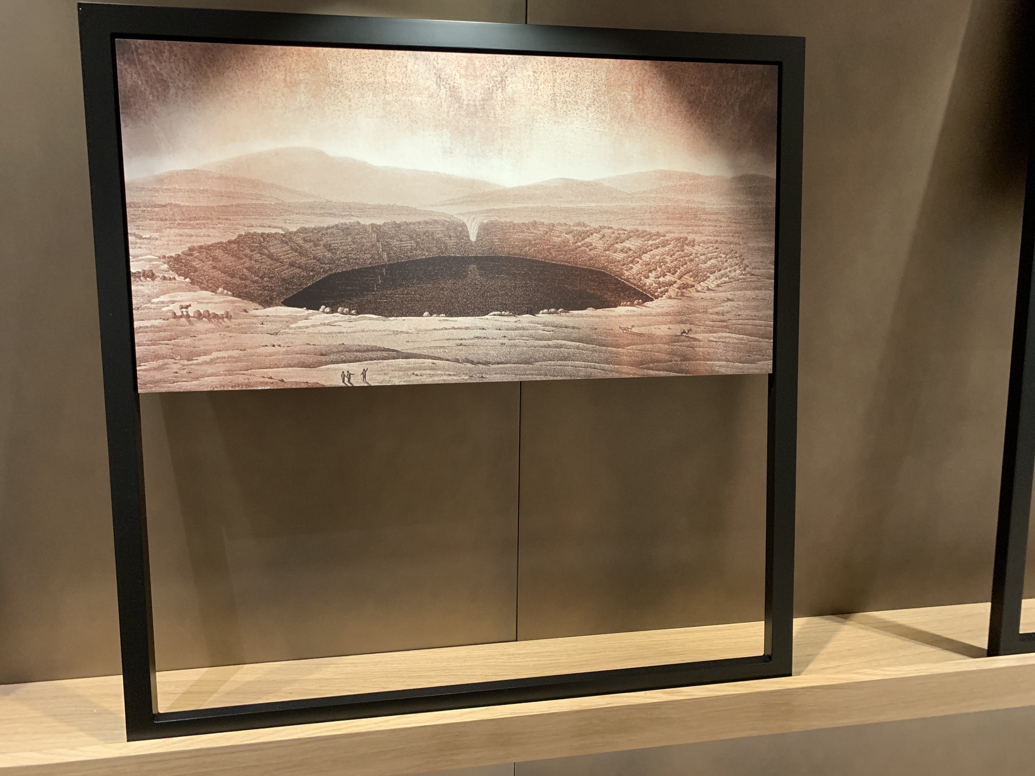 Bronze-toned crater landscape in custom frame